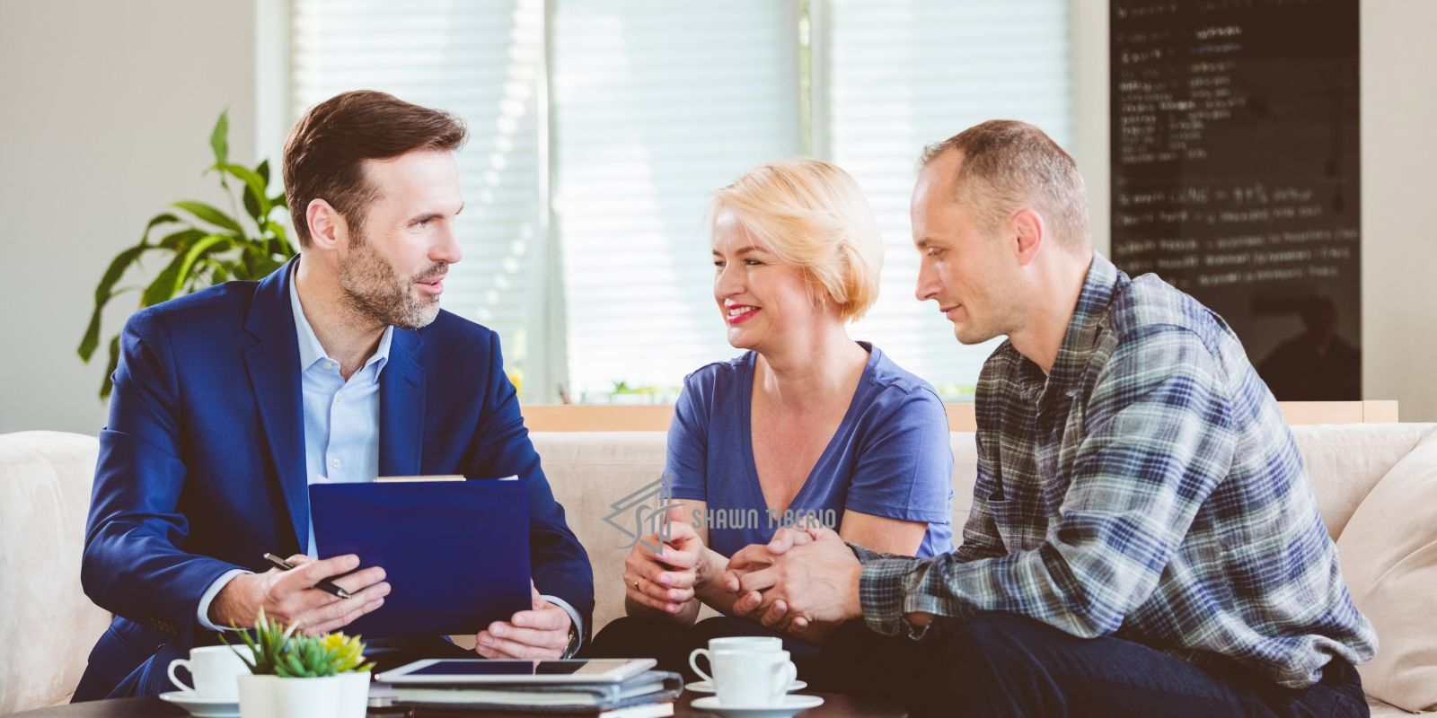 Person coaching middle-aged couple about Real Estate Investing